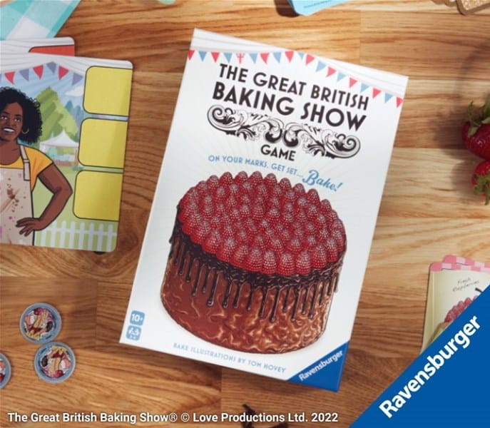 The Ravensburger board game box, titled "The Great British Baking Show Game," showcases an illustrated cake adorned with raspberries. Surrounding the packaging are enticing game pieces and cards, perfect for ages 10 and up.