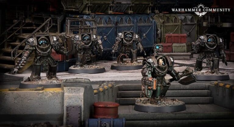 A Warhammer 40K scene featuring five armored miniature figures in a detailed industrial setting. The Iron Hands warriors, equipped with heavy armor and weapons, stand on a textured battlefield with industrial machinery in the background, echoing the dark tales of the Horus Heresy.