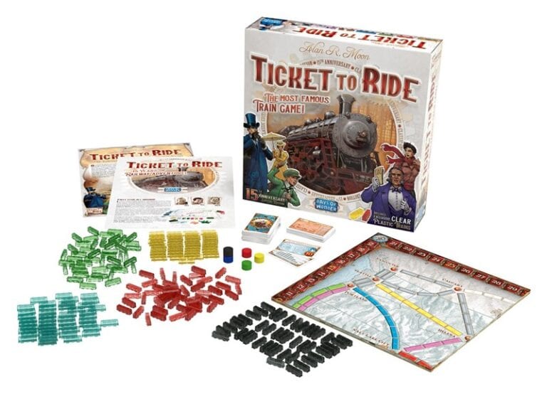 The image showcases the board game "Ticket to Ride" by Days of Wonder, featuring an open game box, rulebook, colorful train cards, small train pieces, and a map with routes. Celebrating its 15th Anniversary Edition, this game's theme revolves around building strategic train routes.