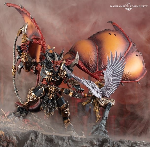 A detailed model of Ka’bandha, an armored demon from The Horus Heresy, with large, bat-like wings stands in a misty environment. The figure holds a weapon, and gold and black armor details are prominent. A smaller winged figure appears in front, creating a dramatic scene crafted by Games Workshop.