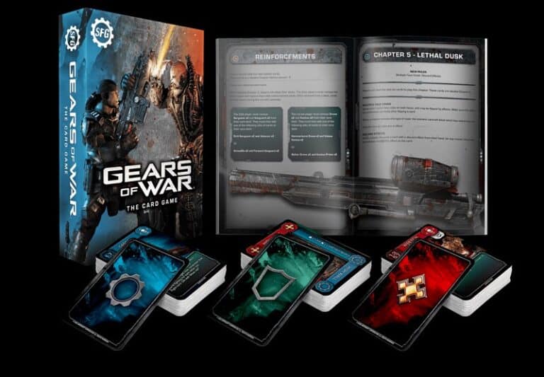 This image showcases "Gears of War: The Card Game" set by Steamforged. It features a game box with artwork of futuristic soldiers, an open instruction book, and vibrant, illustrated playing cards scattered below, capturing the intense essence of the iconic series.