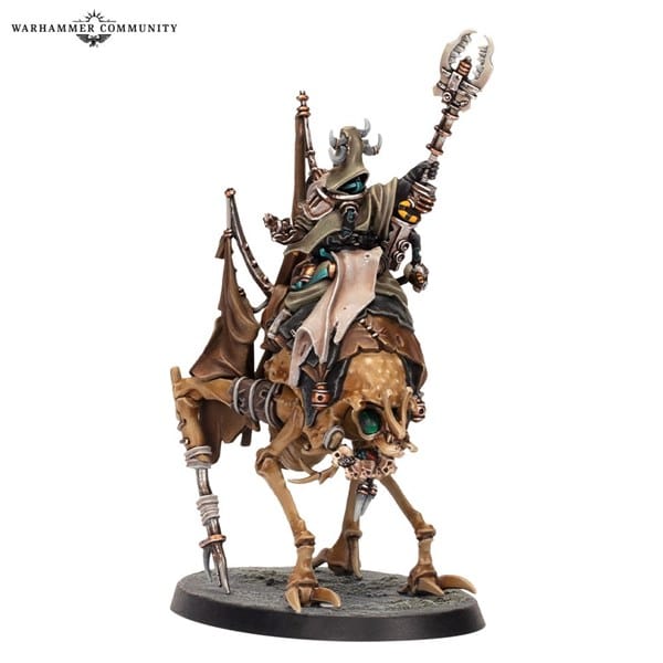 A detailed miniature model of a cloaked figure riding a skeletal, mechanical creature. Echoing the Ash Waste Stormcallers from Necromunda, the figure holds a staff with a metallic, ornate design. The piece is intricately painted with earthy tones and metallic accents, set on a textured base.