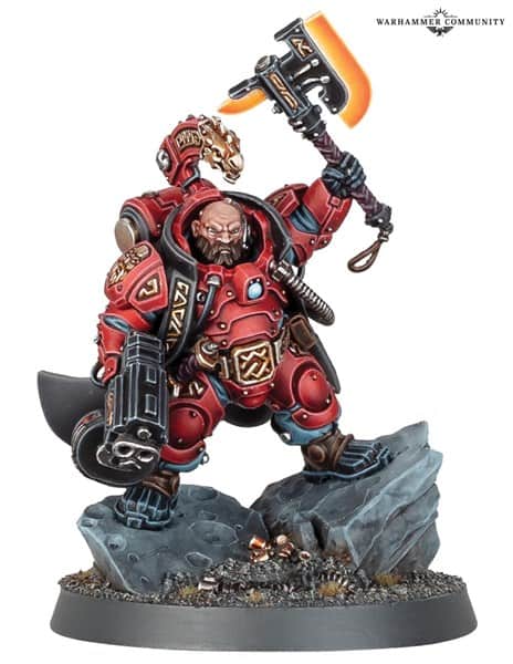A detailed miniature figurine of a heavily armored warrior from the Leagues of Votann in red armor, holding a large weapon resembling a hammer with a glowing orange edge, stands on a rocky base. The armor is ornate with various symbols and designs, embodying the essence of 40k battles.