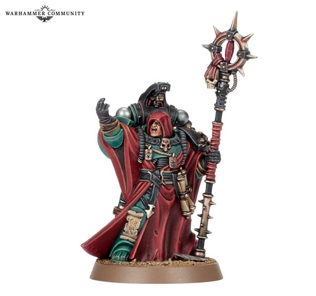 A detailed miniature figure of a robed warrior holding a spiked staff. The figure has intricate armor with skull motifs and a hooded cloak, standing on a textured base. An emblem in the top left corner reads "Warhammer Community," echoing its rich lore from The Horus Heresy by Games Workshop.