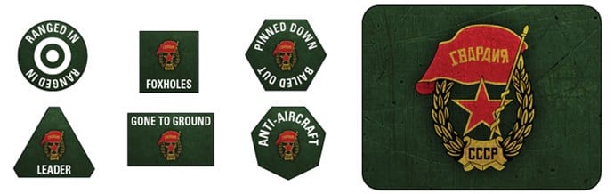 Various military-themed badges on a green terrain background. Designs include a red star, skulls, and phrases like "RANGED IN," "FOXOLES," "LEADER," and "ANTI-AIRCRAFT." A large emblem with a wreath, red banner, and Soviet-era "СССР" text is featured among the accessories.