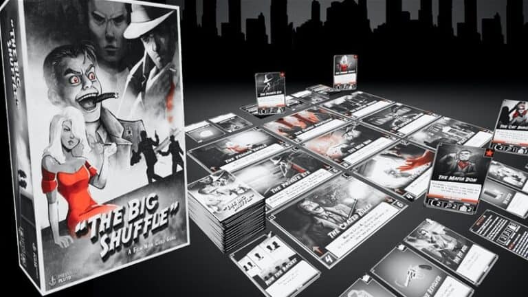 The image showcases "The Big Shuffle," a card game with dramatic film noir-style artwork. The black-and-white game box depicts a detective scene, while the components and cards are artfully spread on a table. A city skyline looms silhouetted in the background, capturing the essence of this Kickstarter project.