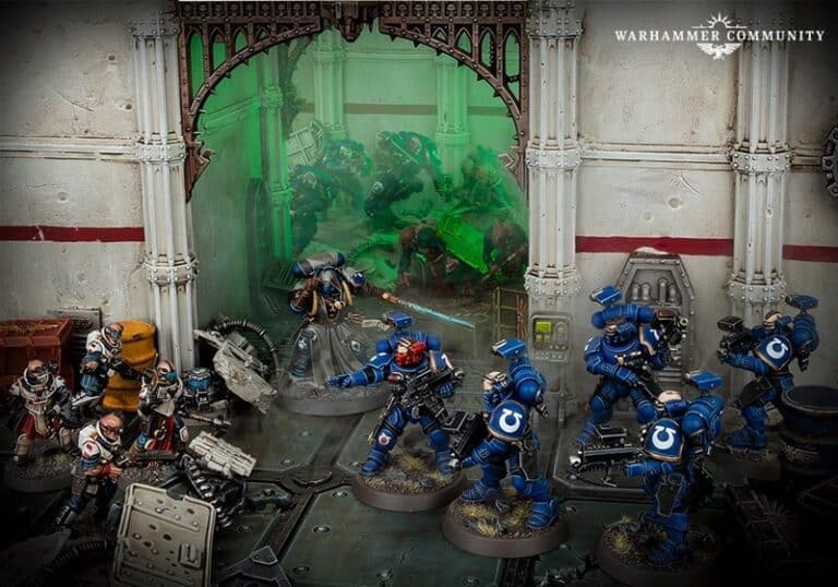 In a dynamic battle scene, Warhammer 40k Ultramarines form a Vanguard Spearhead, their iconic blue armor vivid against the sci-fi backdrop. Engaged in fierce combat with opposing forces, the detailed futuristic scenery of weapons and machinery brings Games Workshop's vision to life.