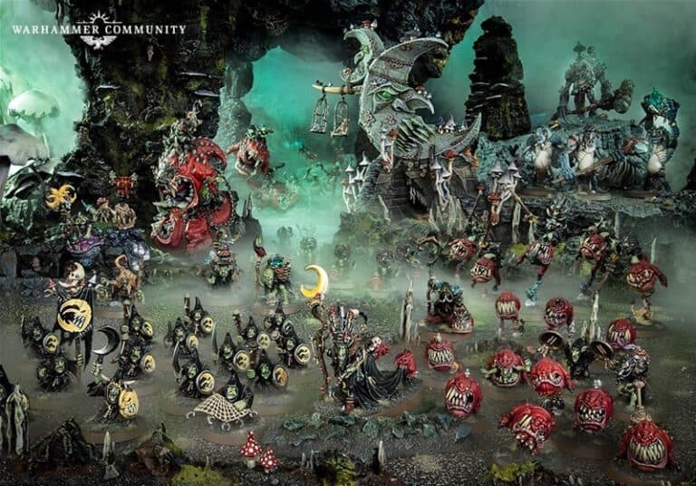 A detailed tabletop scene features various Warhammer fantasy figures, including Da Bad Moon's Gloomspite Gitz. The setup showcases colorful, monstrous creatures and warriors poised to invade, surrounded by an elaborate terrain with mist and dark, rocky formations.