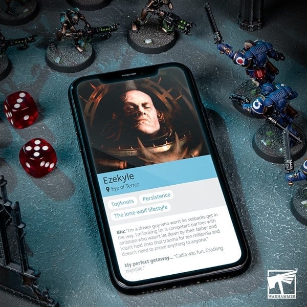 A smartphone showing a fictional character profile of "Ezekyle" rests on a gaming table surrounded by miniature figurines and red dice. The screen highlights details like "Eye of Terror" and "Topknots," all bathed in the Grim Darkness of the Warhammer Community logo.
