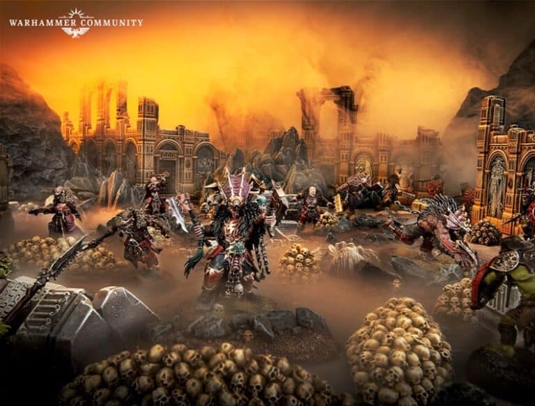 A detailed diorama of fantasy warriors in elaborate armor on a battlefield. The scene includes ruined stone structures and skull-covered terrain under an orange, foggy sky, with the Claws of Karanak poised for battle and echoing their fearsome warcry.