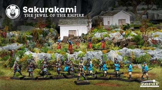 Miniature figurines in traditional Japanese attire, including noble samurai warriors, are set on a landscaped diorama with greenery, rocks, and small buildings. Text reads "SAKURAKAMI: The Jewel of the Empire" and "Zenit.
