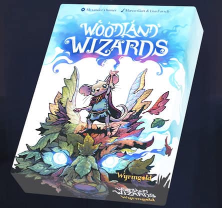 The vibrant "Woodland Wizards" card game box showcases a mouse wizard wielding a staff, standing on large leaves infused with magical aura. The scene is alive with mystical creatures and elements, evoking the whimsy of the Wilderland Cup.