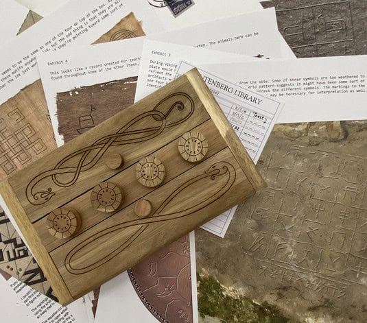 A wooden puzzle box with intricate designs and dials sits atop various printed papers featuring ancient symbols and textures, evoking a supernatural journey. The papers, adorned with text and images, resemble archaeological findings and cryptic Norse mythology inscriptions.