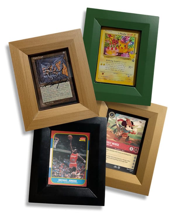 Four framed trading cards on display. Top left: vintage-style card. Top right: Pikachu with floral background. Bottom left: basketball player in action. Bottom right: Mickey Mouse card with colorful elements. Each card is showcased in a unique colored Frameamajigs collectable card frame.