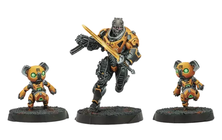 In May's new releases, discover three futuristic, armored game miniatures from the Infinity series: a tall central figure with a glowing sword and two smaller figures with glowing green eyes. All wear striking orange and black armor, standing on textured black bases.