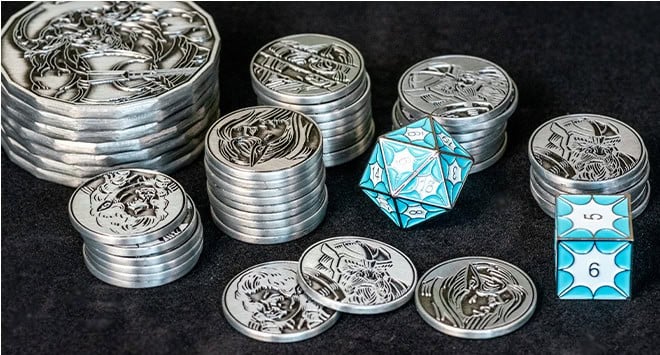 Stacks of intricately designed character coins, featuring detailed portraits, are displayed on a dark surface. Beside them, a blue metallic twenty-sided die and a six-sided die are arranged, adding a touch of color and enhancing the RPG experience with unique charm.