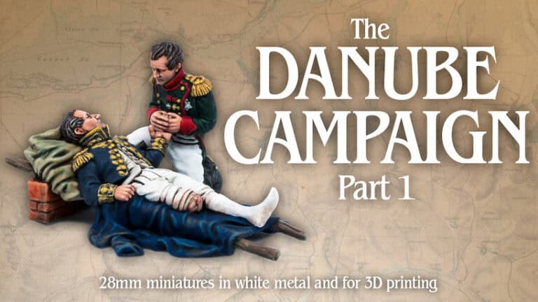 Two military figures in historical uniforms are depicted, one sitting with a bandaged leg while the other kneels nearby. The text reads "Napoleon's Last Triumph: The Danube Campaign Part 1," with a note about 28mm miniatures in white metal and an exclusive Kickstarter offer for 3D printing enthusiasts.