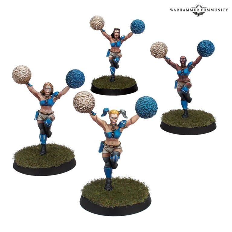Four miniature cheerleader figures dressed in blue outfits, each holding pom-poms, enliven your Blood Bowl tabletop set. Posed on grassy bases, they bring dynamic energy with their varied stances, ready to cheer the team and charm even the sternest refs.