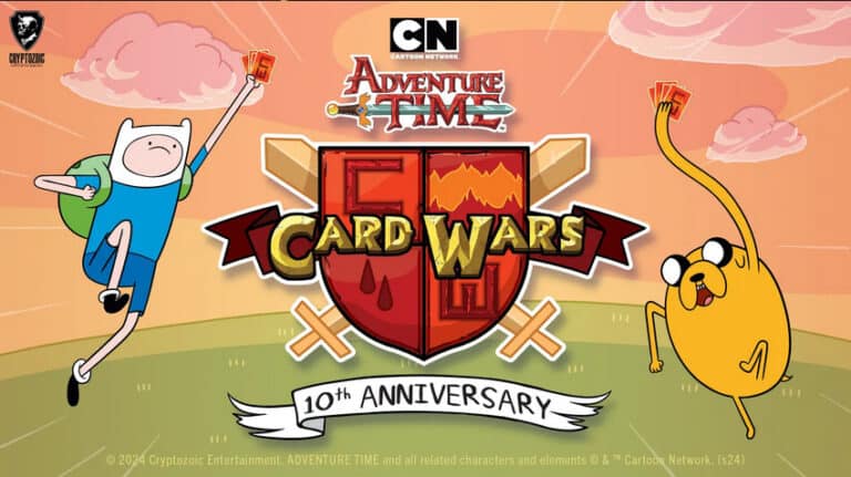 Finn and Jake from Adventure Time are celebrating the 10th anniversary of "Card Wars," now backed by a Kickstarter Campaign. They hold up cards against a colorful background featuring the Adventure Time logo and Cryptozoic Entertainment's branding.
