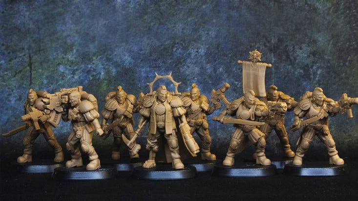 Seven unpainted miniature figures of armored soldiers, part of the Recon Squad Miniatures from the Imperial Crusade collection, are displayed in a row. Each figure holds a different weapon or accessory and stands on round black bases against a mottled blue and green backdrop.