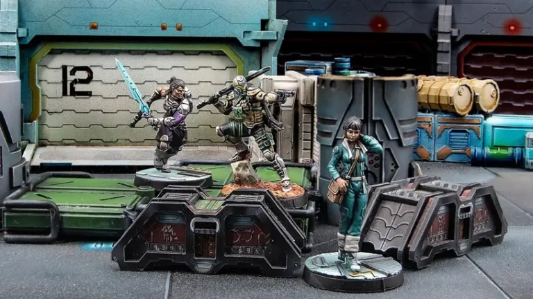 Miniature figures on a sci-fi-themed diorama form the final showcase. Two figures in combat poses with swords and futuristic armor, one male and one female, stand ready. A female figure in casual attire observes. The backdrop features industrial, Infinity-inspired structures and details.