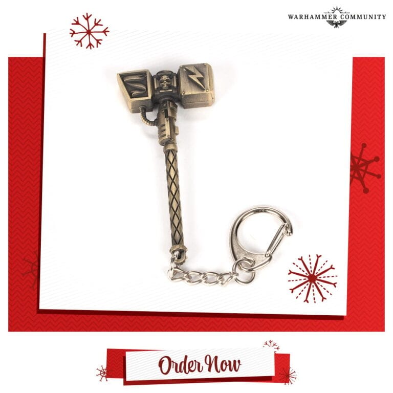 A keychain shaped like a hammer with intricate designs hangs on a red and white background decorated with snowflakes. Perfect as stocking fillers, this charming piece will delight any fan of Games Workshop. At the bottom, a banner reads "Pre-order Now.