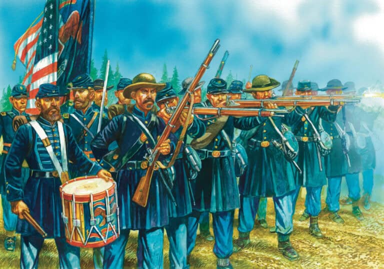 A group of Union soldiers in blue Civil War uniforms, from the new sets by Warlord Games, march and aim their rifles, with one holding a drum. An American flag waves in the misty battlefield background, capturing a vivid scene from the American Civil War.