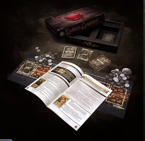 A tabletop game setup featuring a rulebook, game board, cards, and coins. The game's box, labeled "Dark Deeds Card Game," is open in the background, with its lid resting nearby. Created by Modiphius Entertainment, the scene is dark and atmospheric.