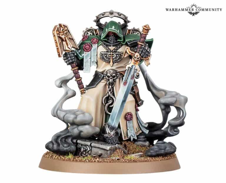 A detailed Warhammer miniature figure stands, cloaked in dark armor emblematic of the Dark Angels, holding a large sword and staff. The base showcases mist and rocky elements, with intricate designs from Games Workshop adorning the figure. The background is plain white.