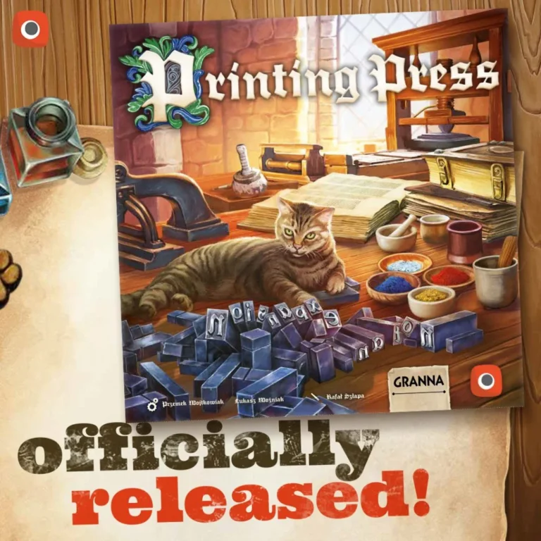 A board game titled "Printing Press" is displayed by Portal Games. The cover art features a cat lounging among printing tools and blocks in a workshop setting. Text below announces "officially released!" Items like an inkwell and paper are partially visible.
