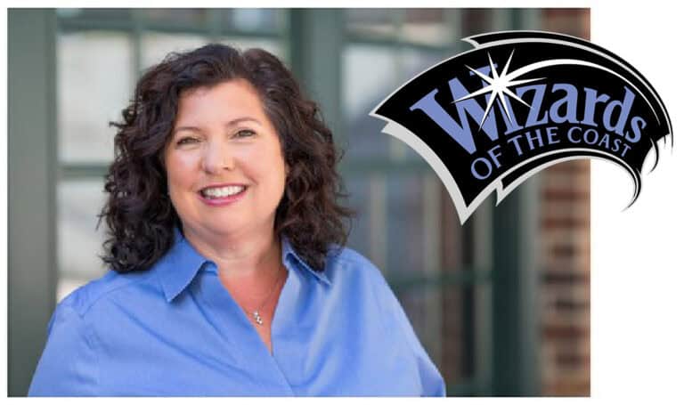 Cynthia Williams, with her curly dark hair, smiles in a blue shirt. To the right, the "Wizards of the Coast" logo with its star design is visible. The background shows a blurred building facade, hinting at changes following her recent resignation.