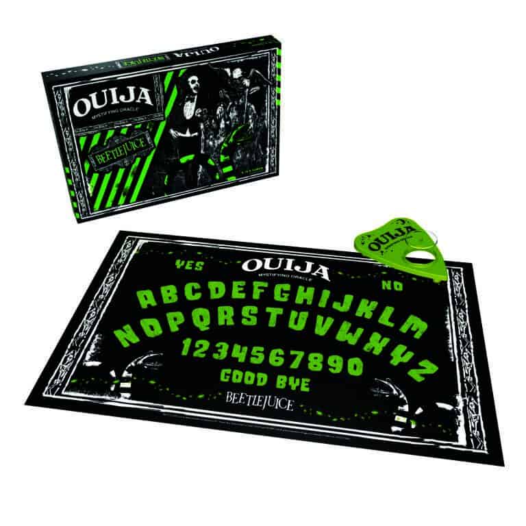 The Op Games presents the Beetlejuice Edition OUIJA board set, featuring a black and green board with the alphabet, numbers, and words "Yes", "No", and "Goodbye." Complete with a matching planchette and a box adorned with images from the Beetlejuice movie.