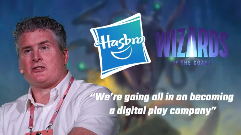 A person stands speaking in front of a backdrop featuring the Hasbro and Wizards of the Coast logos, with text overlayed: "We're going all in on becoming a digital play company, aiming for enhanced digital profit.