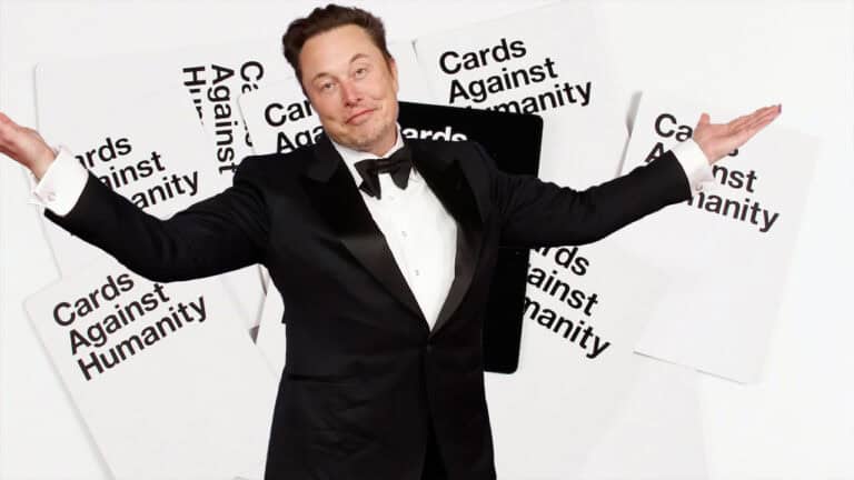A person in a tuxedo stands with arms outstretched before a backdrop of "Cards Against Humanity" cards, as if ready to launch into a humor-filled universe, much like SpaceX embarking on an exploration adventure.