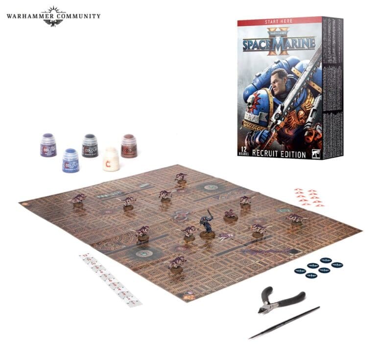 Board game setup featuring Warhammer 40K: Space Marine Recruit Edition. Ideal for tabletop wargamers, it includes a game board with miniature figures, paint pots, a box with artwork, dice, measuring tools, and extra gaming pieces on a white background.